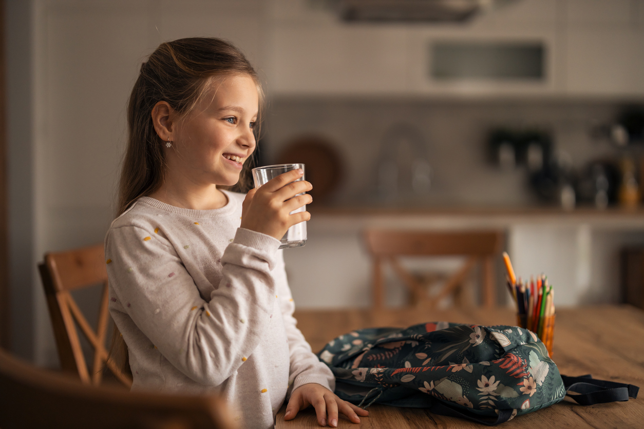 happy kid drinking water